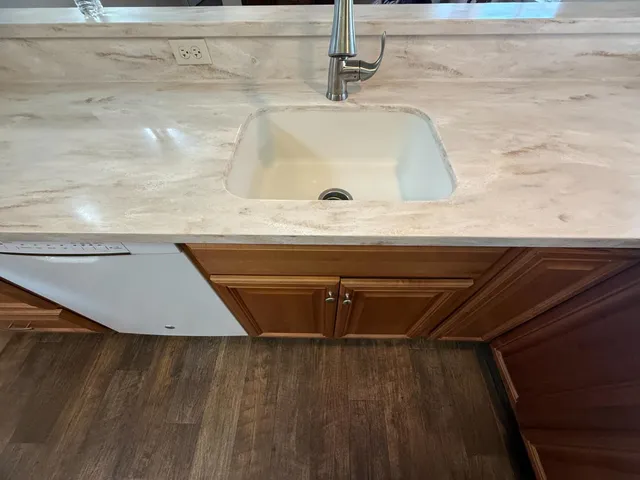 a bathroom with a toilet a sink and a mirror