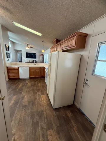 a bathroom with a double vanity sink a mirror and a shower