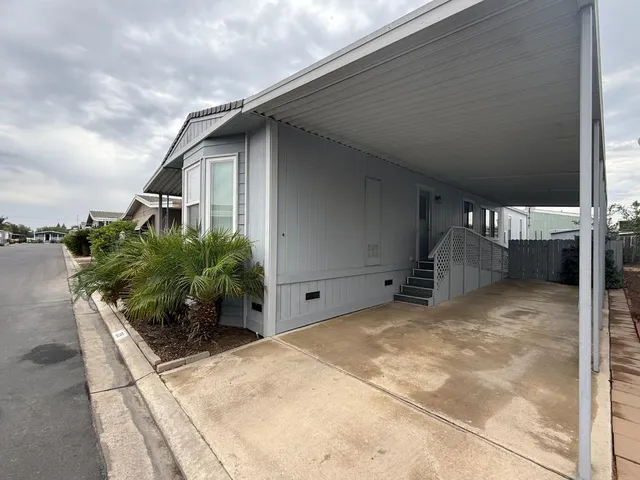 a view of backyard with seating space