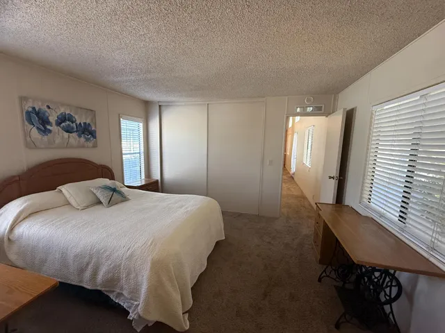 a bathroom with a sink mirror vanity and toilet