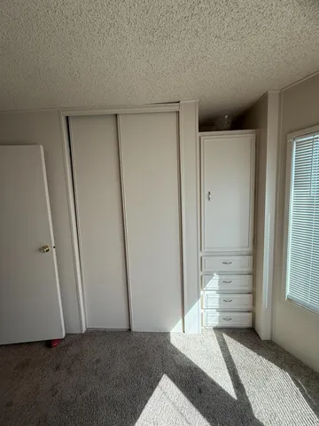a view of livingroom with furniture and front door