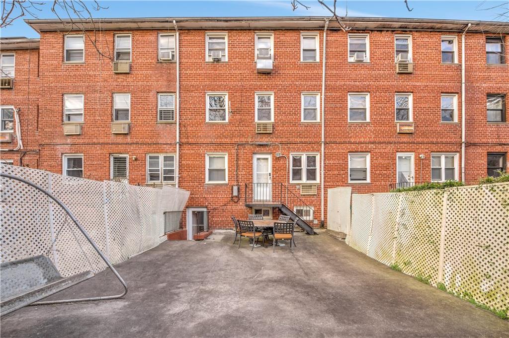 1262 East 73rd Street Brooklyn, NY 11234 - Photo 11 of 26 a row of brick building with many windows