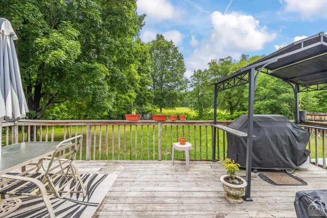 a view of a chair and table in the balcony