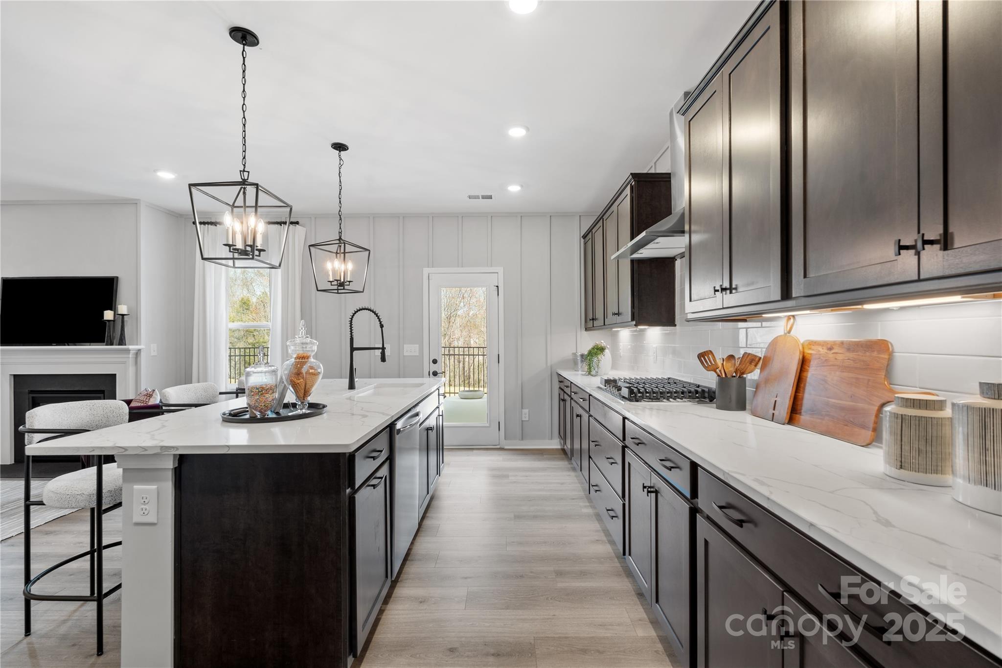2042 Puddle Pond Road Indian Trail, NC 28079 - Photo 3 of 21 a kitchen with stainless steel appliances a sink stove and cabinets