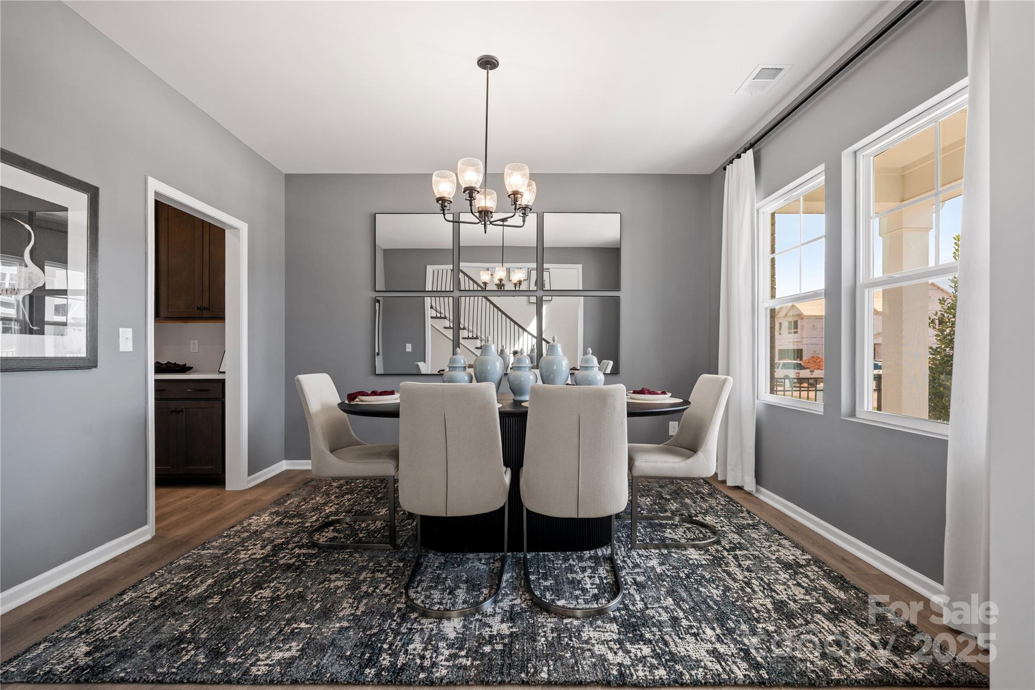 2042 Puddle Pond Road Indian Trail, NC 28079 - Photo 4 of 21 a view of a dining room with furniture window and wooden floor