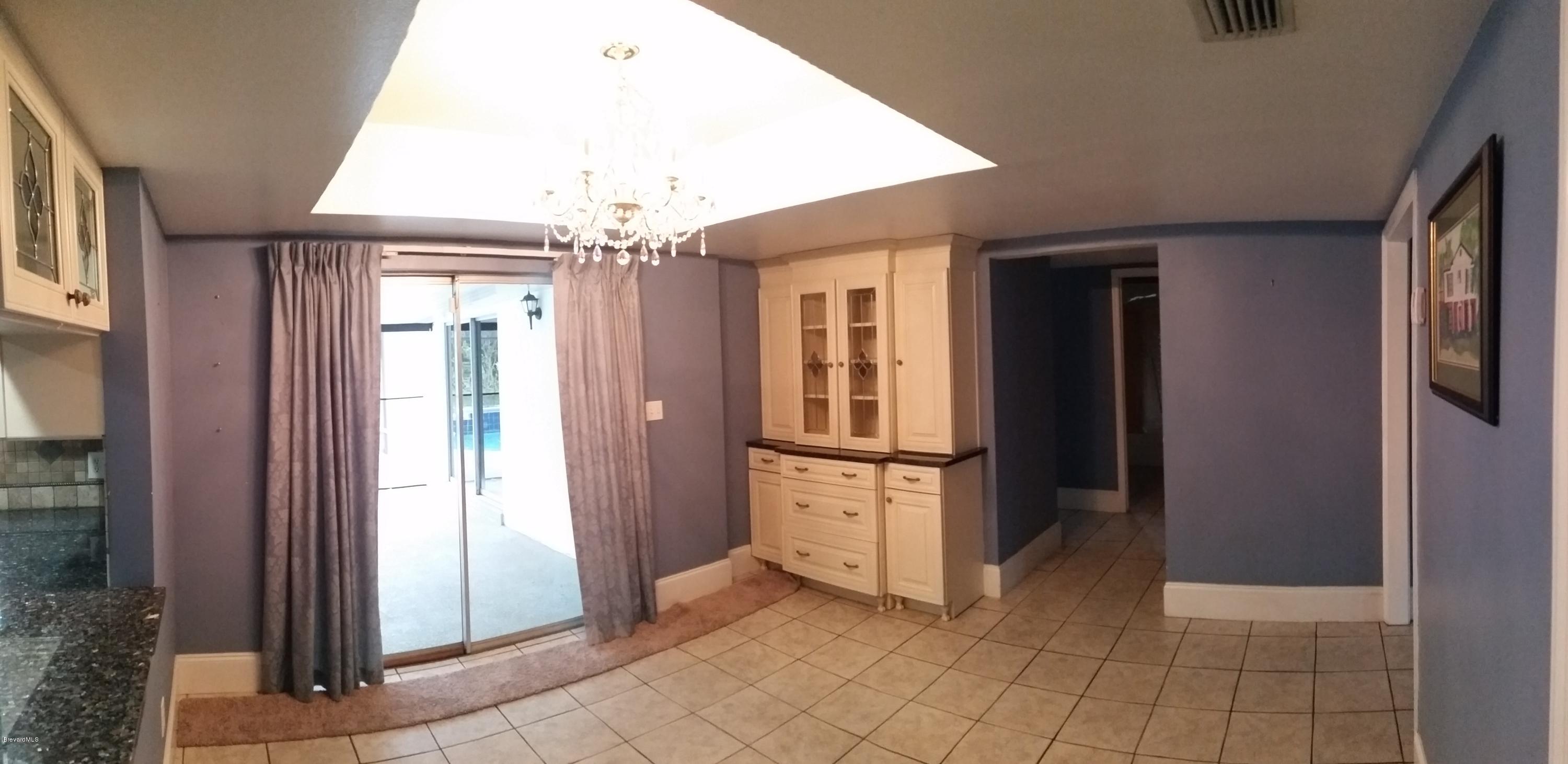 2420 Harlock Road Melbourne, FL 32934 - Photo 6 of 47 Formal dining & crystal chandelier