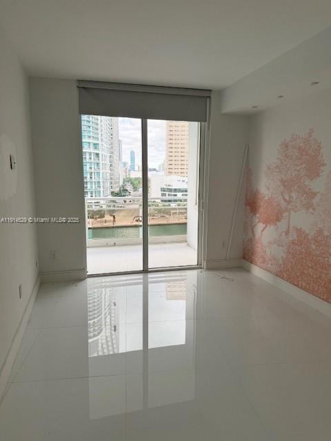 901 Brickell Key Boulevard, Unit 906 Miami, FL 33131 - Photo 16 of 60 a view of an empty room with a window