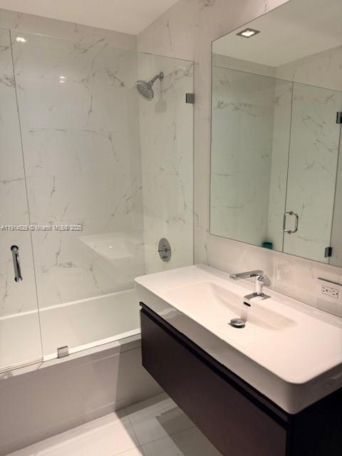 901 Brickell Key Boulevard, Unit 906 Miami, FL 33131 - Photo 17 of 60 a bathroom with a sink a bathtub and a mirror