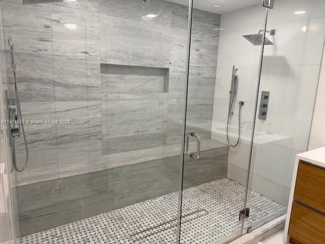 901 Brickell Key Boulevard, Unit 906 Miami, FL 33131 - Photo 26 of 60 a bathroom with a glass shower door