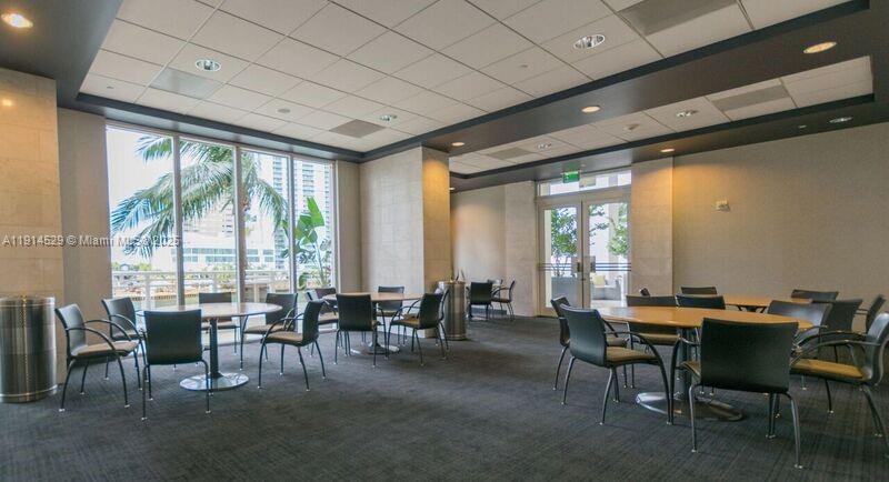 901 Brickell Key Boulevard, Unit 906 Miami, FL 33131 - Photo 52 of 60 a view of a dining room with furniture window and outside view