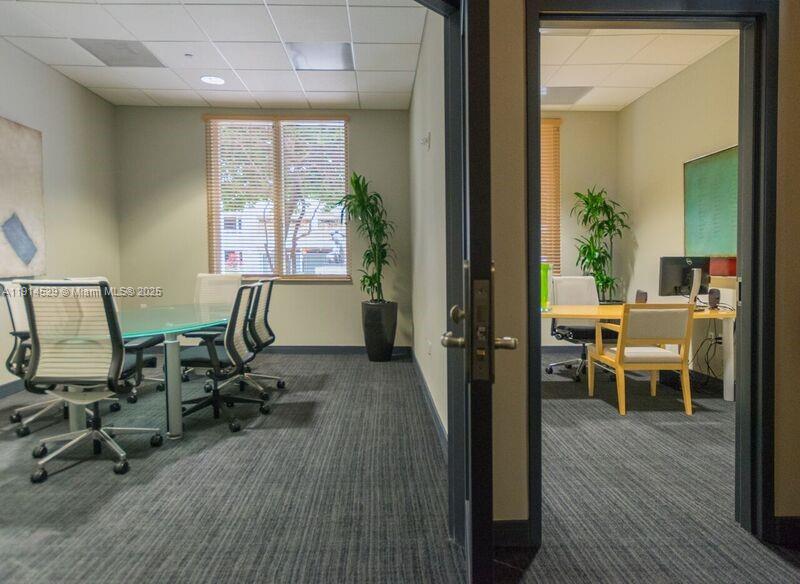 901 Brickell Key Boulevard, Unit 906 Miami, FL 33131 - Photo 58 of 60 a view of a workspace with furniture and a window