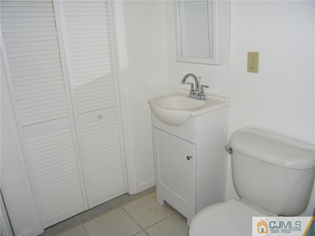 20 Pennington Road New Brunswick, NJ 08901 - Photo 14 of 15 a bathroom with a toilet and a sink