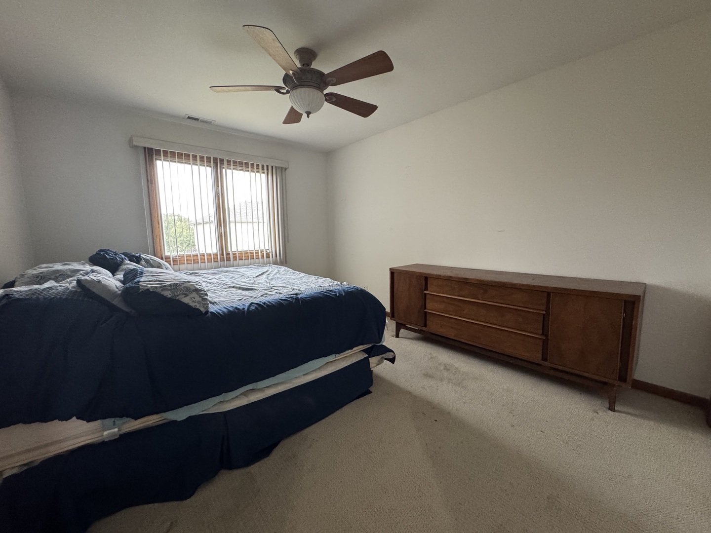 1008 Willow Road Matteson, IL 60443 - Photo 16 of 19 a bedroom with a bed and a window