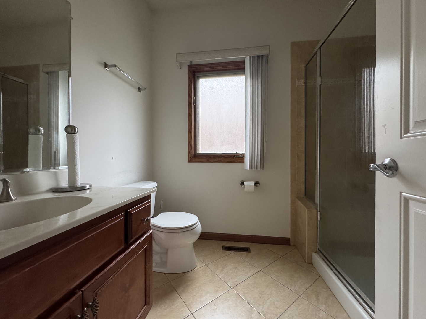 1008 Willow Road Matteson, IL 60443 - Photo 19 of 19 a bathroom with a granite countertop sink toilet and shower