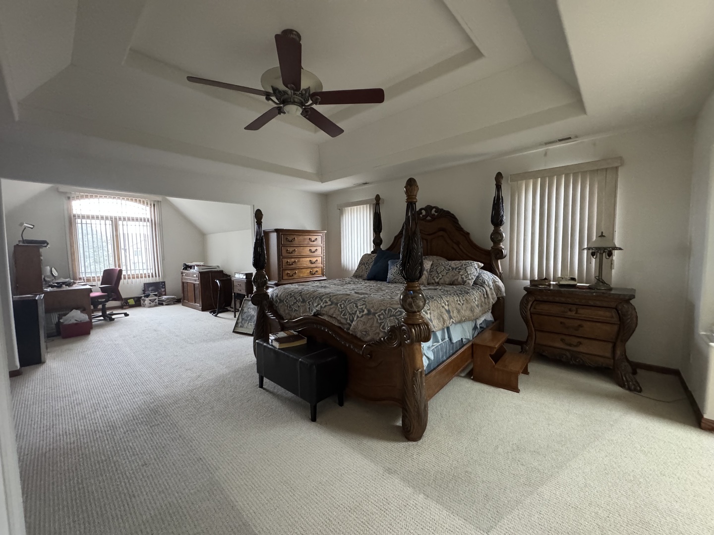 1008 Willow Road Matteson, IL 60443 - Photo 10 of 19 a spacious bedroom with a bed and a chandelier