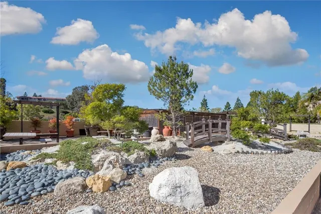 a view of a backyard of the house