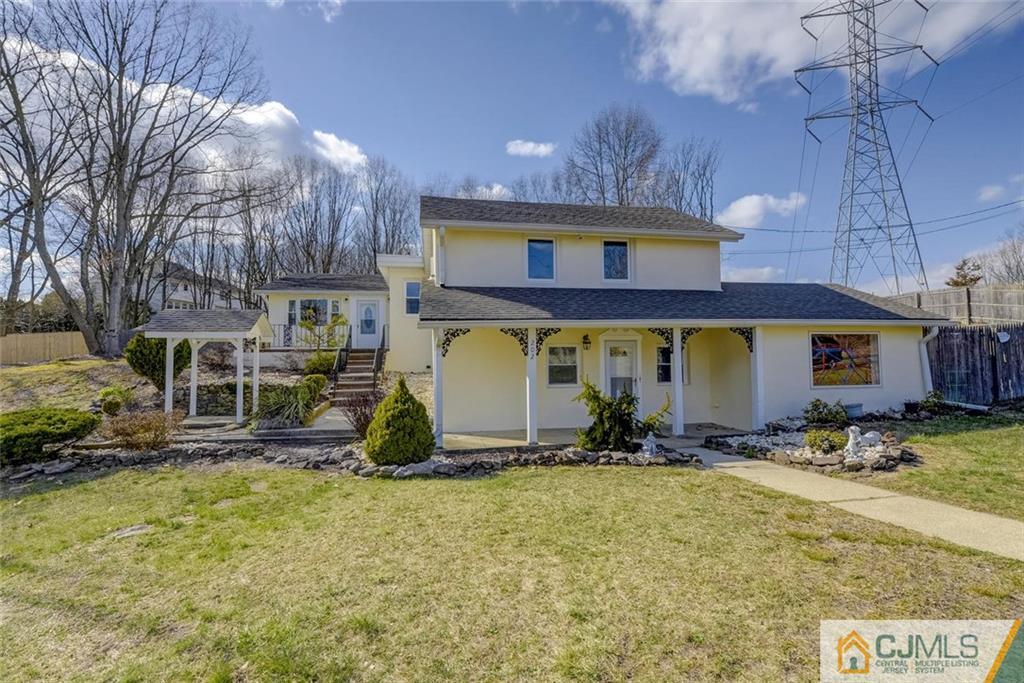 202 Higgins Road Old Bridge, NJ 07747 - Photo 1 of 25 a front view of a house with a yard