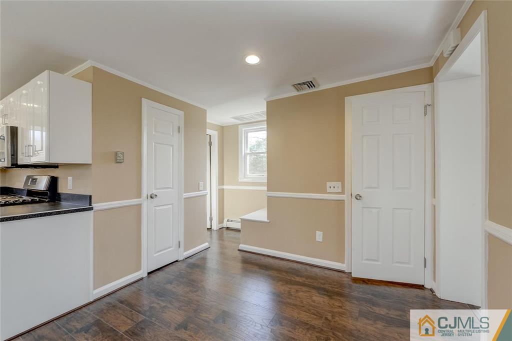 202 Higgins Road Old Bridge, NJ 07747 - Photo 10 of 25 a view of a kitchen with a sink and a refrigerator