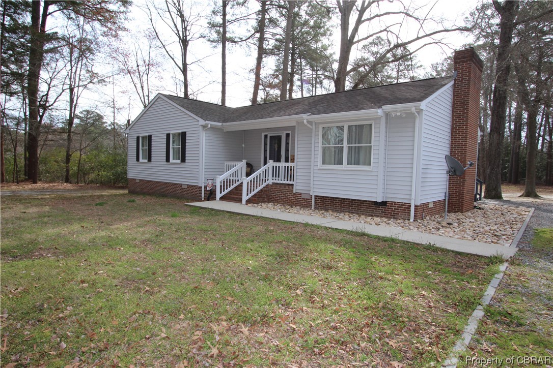 939 Long Road Mathews, VA 23109 - Photo 48 of 50 a view of a house with backyard and chairs