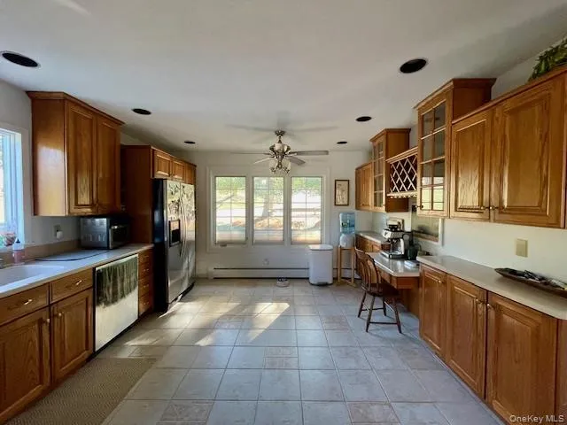 a kitchen with a refrigerator and a sink