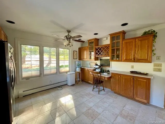 a view of a kitchen with furniture and a window