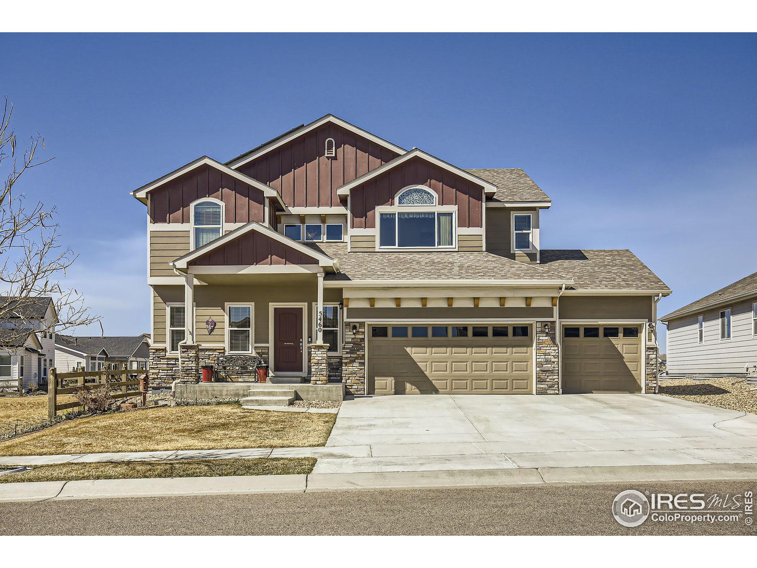 5460 Homeward Drive Timnath, CO 80547 - Photo 1 of 31 a front view of a house with a yard
