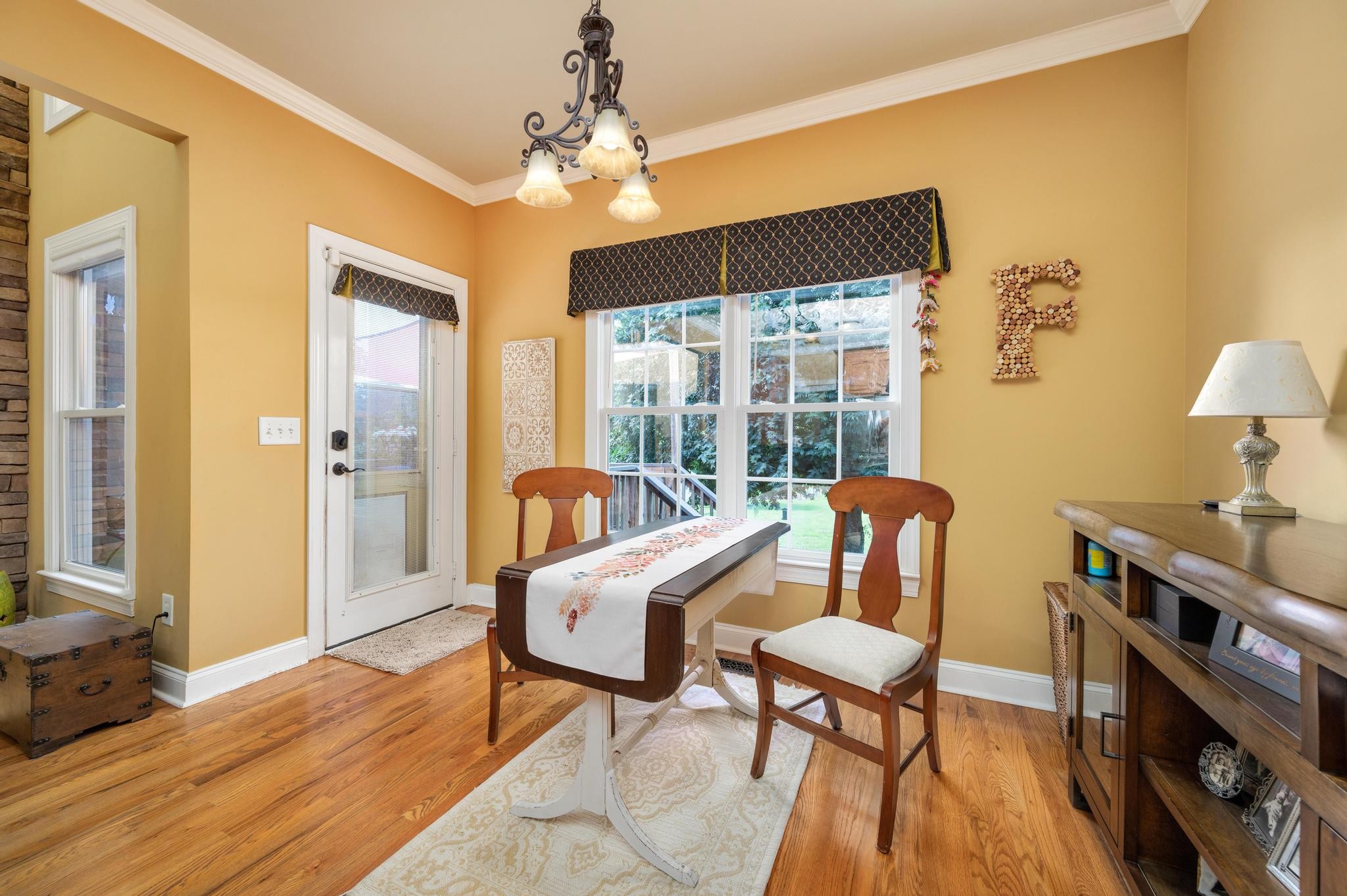 3991 Franklin Road Lebanon, TN 37090 - Photo 17 of 62 a dining room with furniture a chandelier and wooden floor