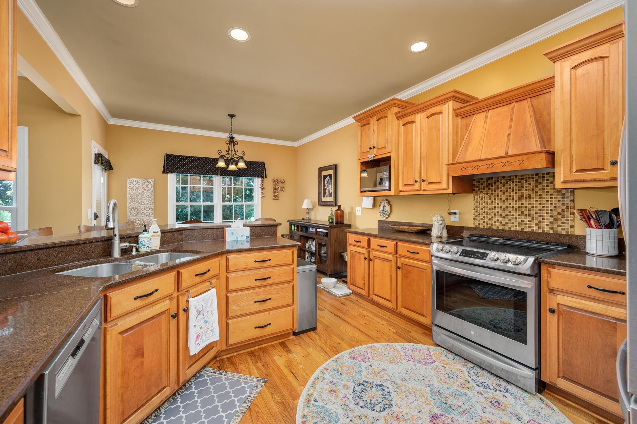 3991 Franklin Road Lebanon, TN 37090 - Photo 19 of 62 a kitchen with stainless steel appliances granite countertop a stove a sink and a refrigerator