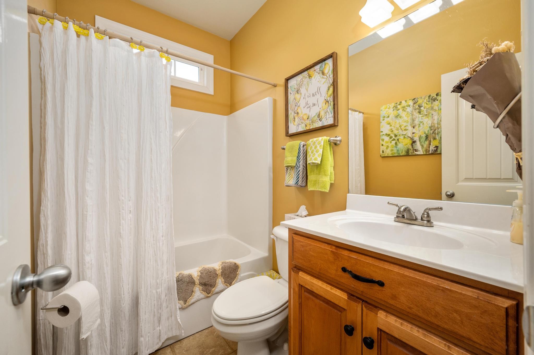 3991 Franklin Road Lebanon, TN 37090 - Photo 28 of 62 a bathroom with a sink a toilet and shower curtain