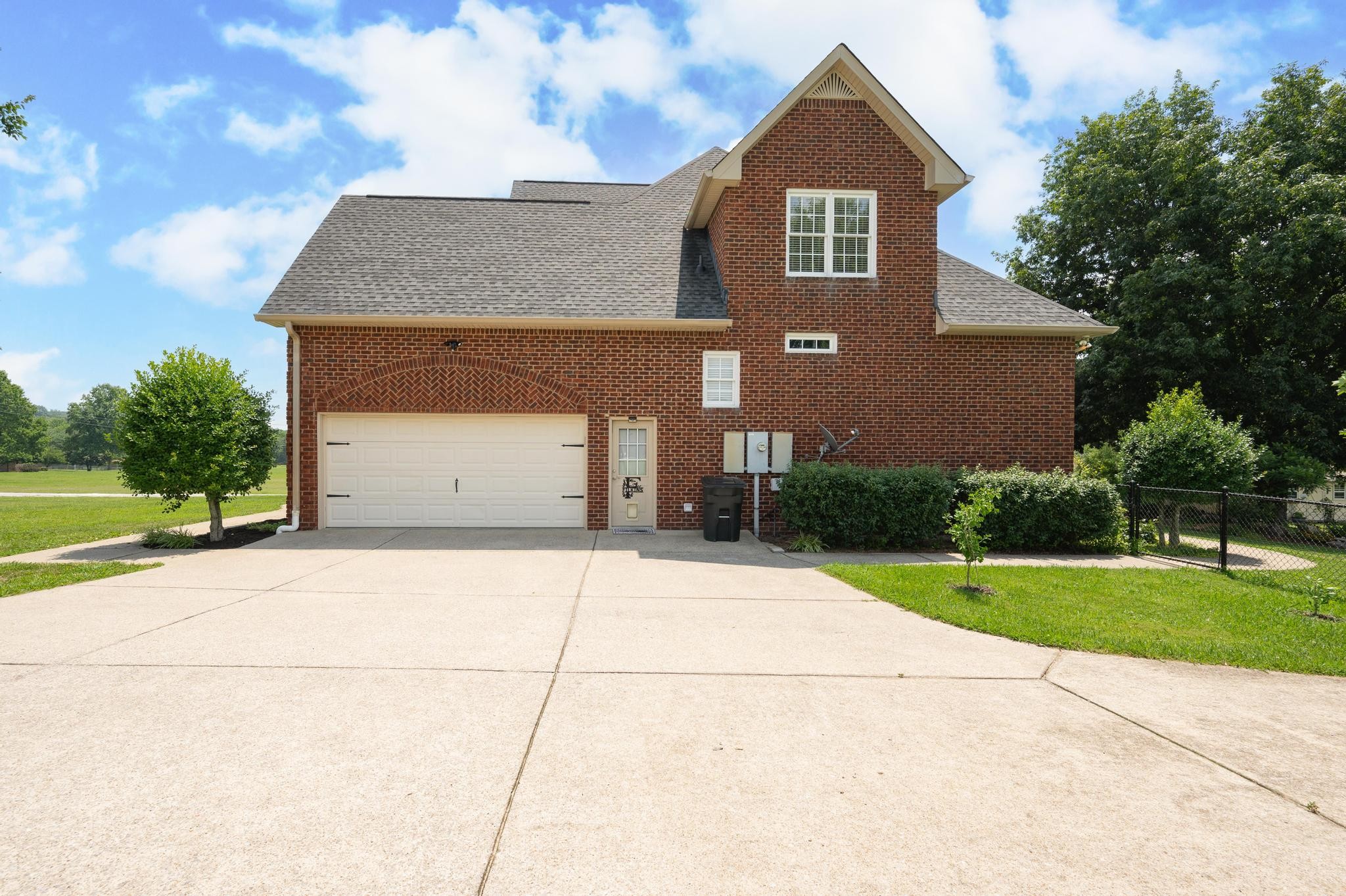 3991 Franklin Road Lebanon, TN 37090 - Photo 6 of 62 a front view of a house with a yard and garage