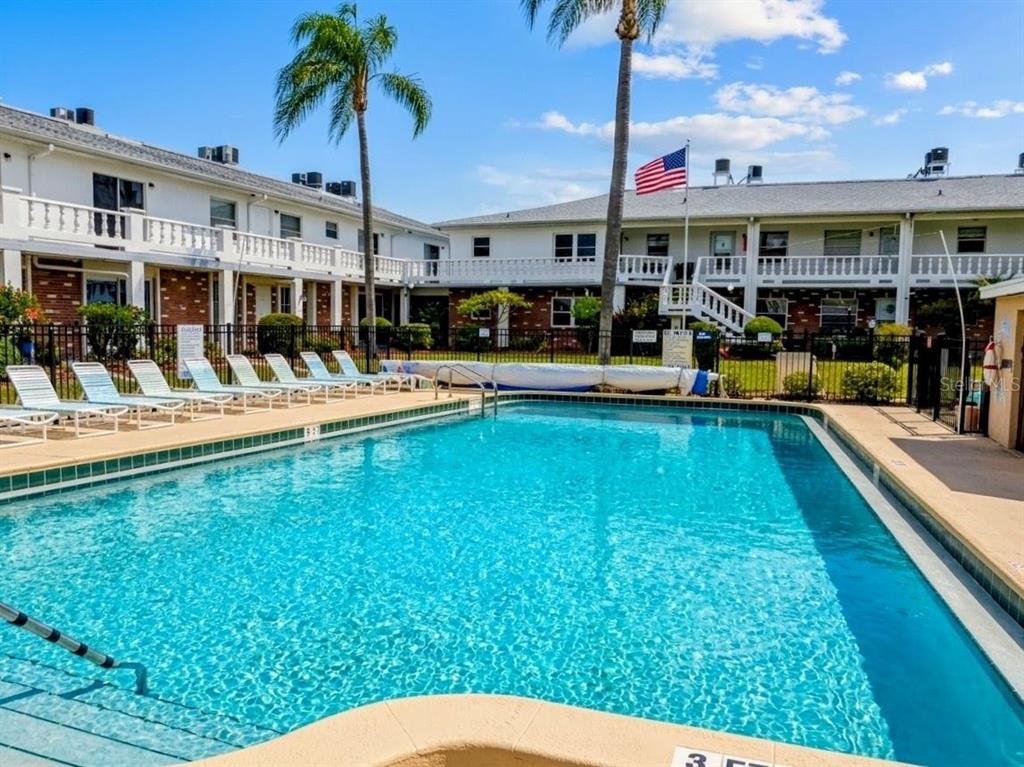 4744 Azalea Drive, Unit 204 New Port Richey, FL 34652 - Photo 19 of 20 a view of a house with a swimming pool
