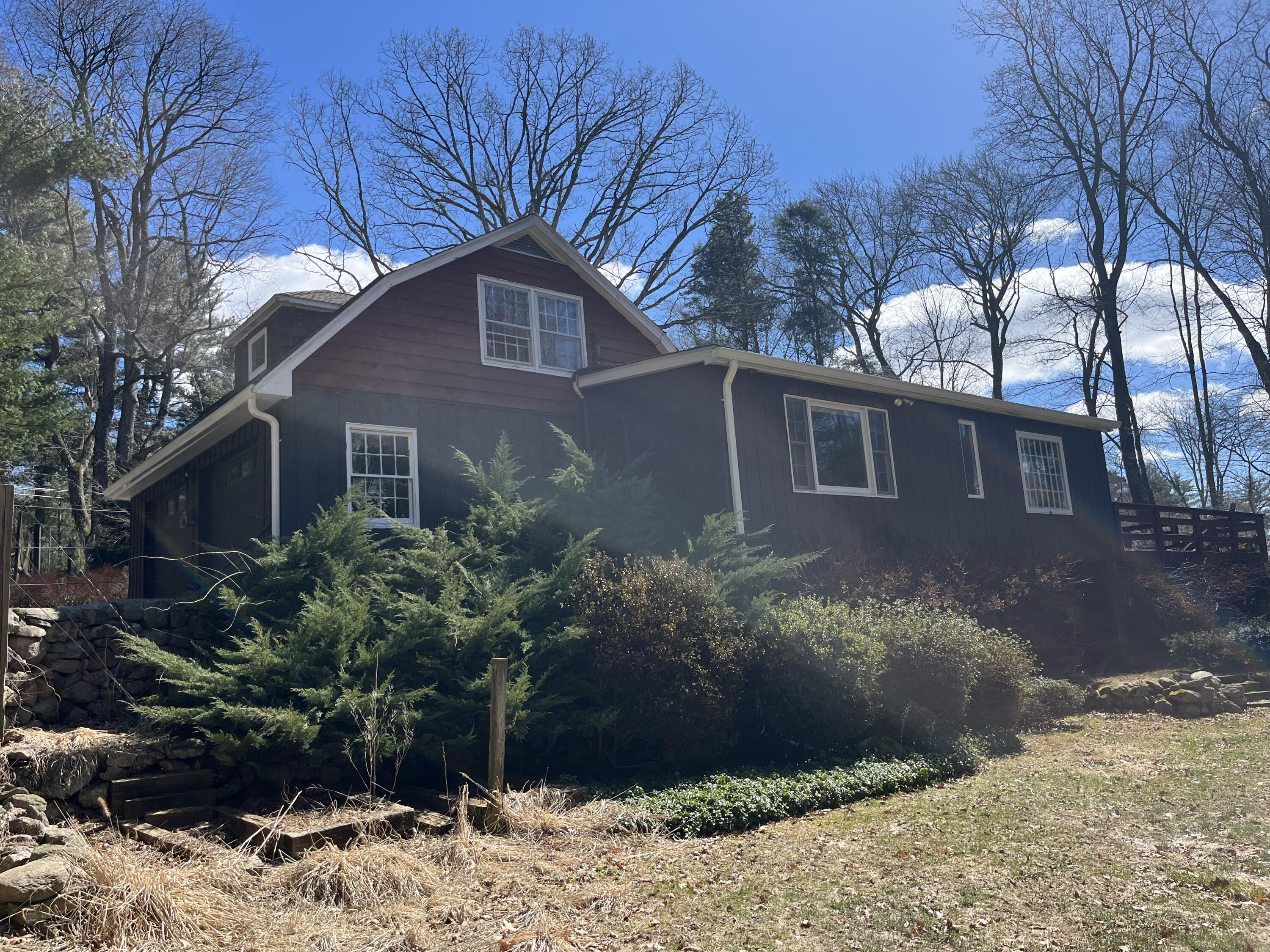 38 Lantern Ridge Road New Canaan, CT 06840 - Photo 15 of 17 a front view of a house with garden