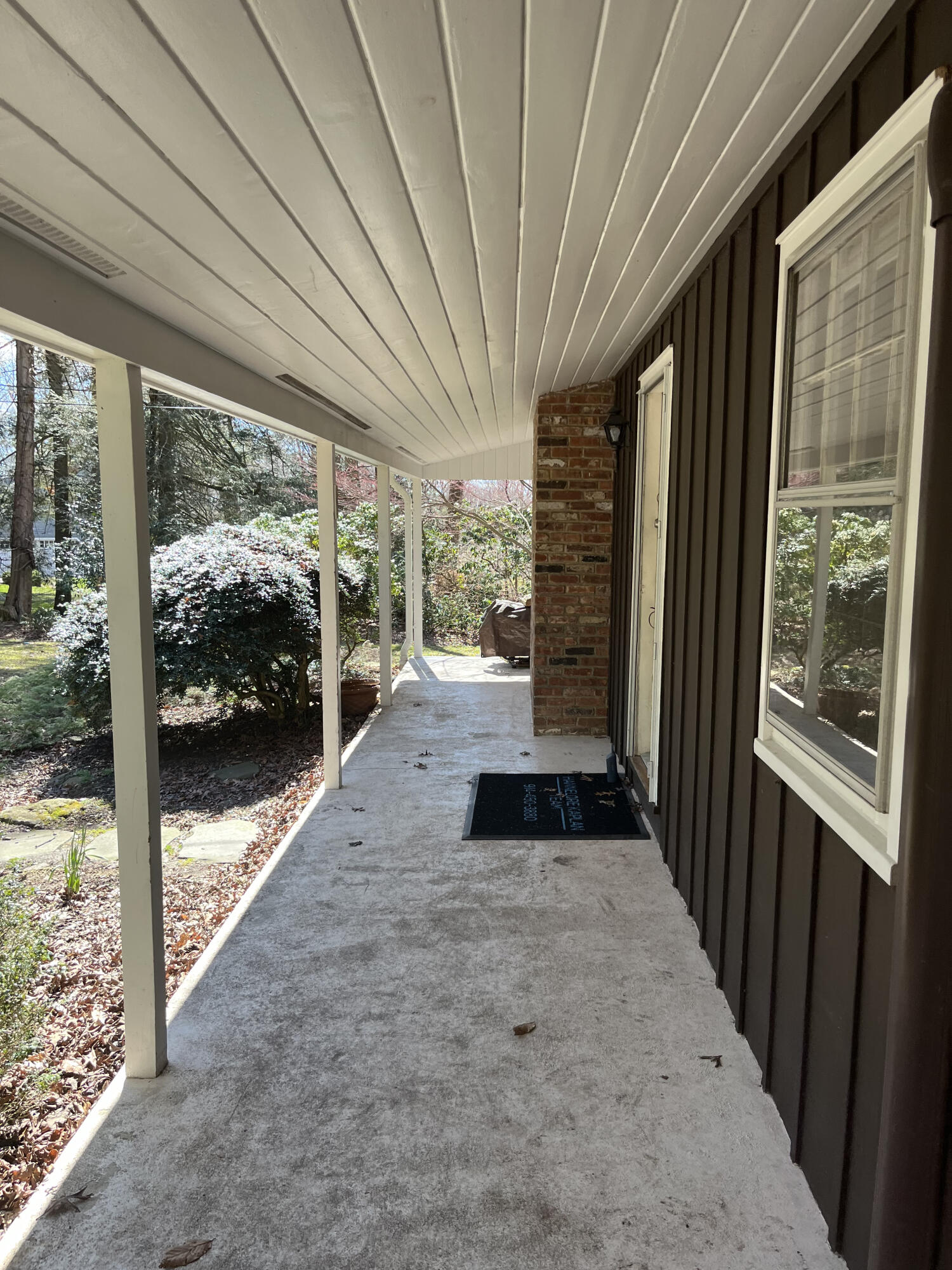 38 Lantern Ridge Road New Canaan, CT 06840 - Photo 2 of 17 a view of a porch with a floor to ceiling window