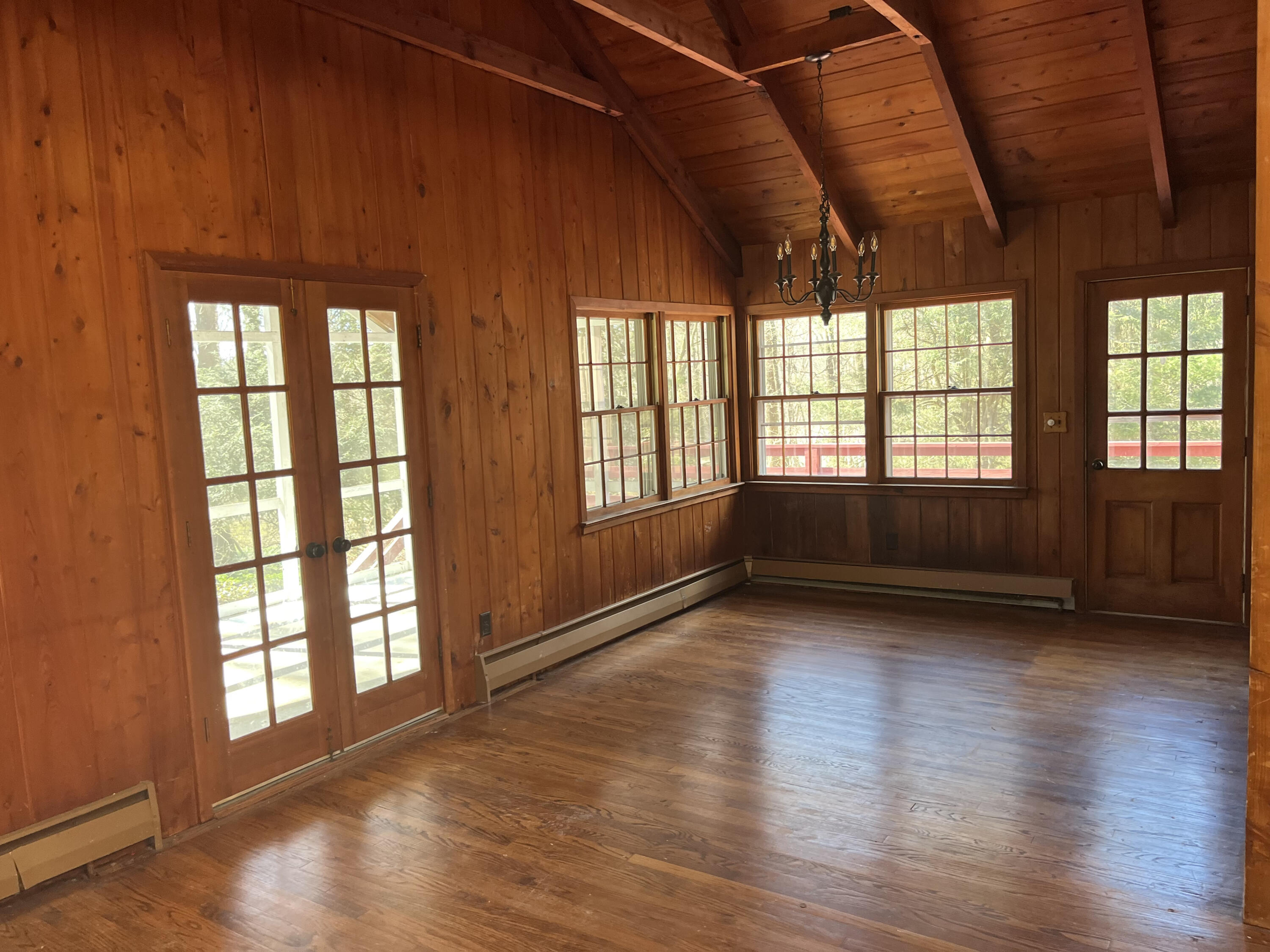 38 Lantern Ridge Road New Canaan, CT 06840 - Photo 4 of 17 a view of an empty room with wooden floor and a window