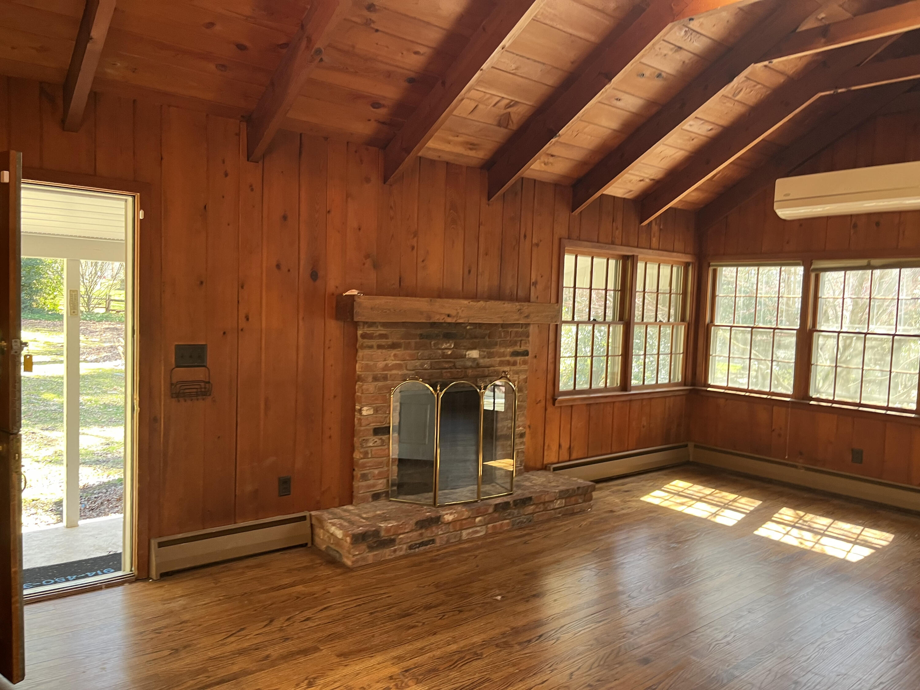 38 Lantern Ridge Road New Canaan, CT 06840 - Photo 5 of 17 an empty room with wooden floor and windows