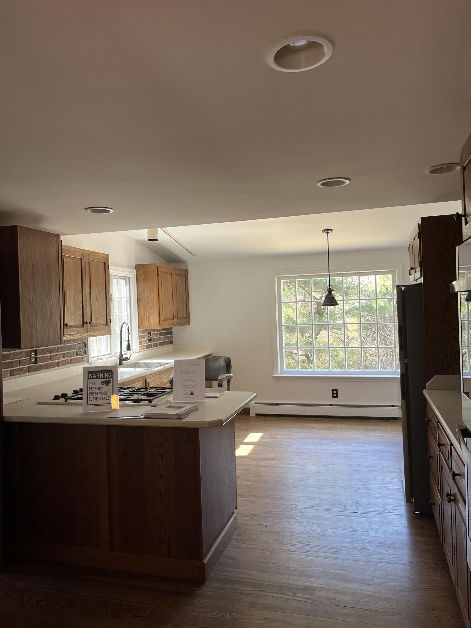 38 Lantern Ridge Road New Canaan, CT 06840 - Photo 6 of 17 a kitchen with counter top space and wooden floor
