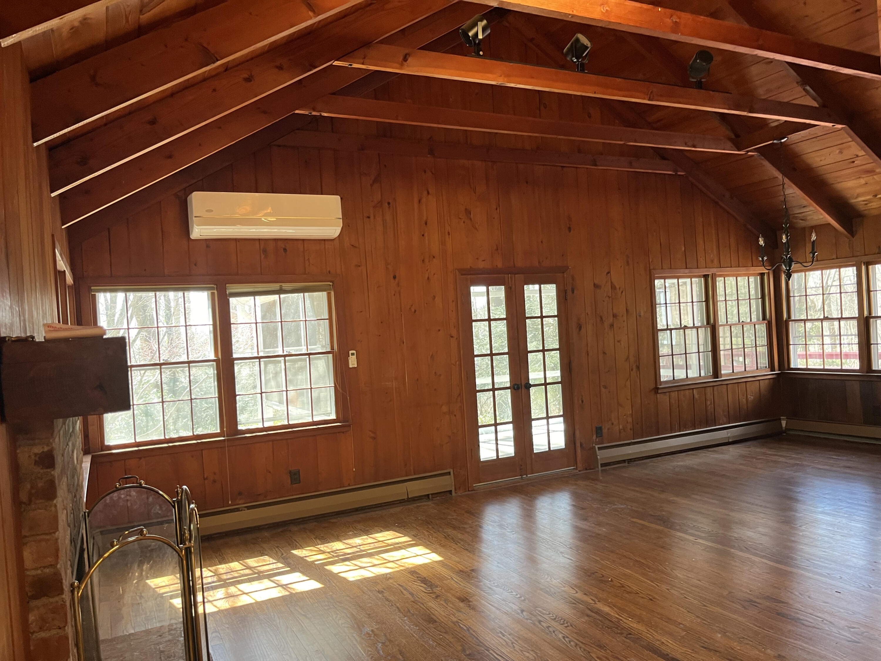 38 Lantern Ridge Road New Canaan, CT 06840 - Photo 7 of 17 a view of an empty room with wooden floor and a window