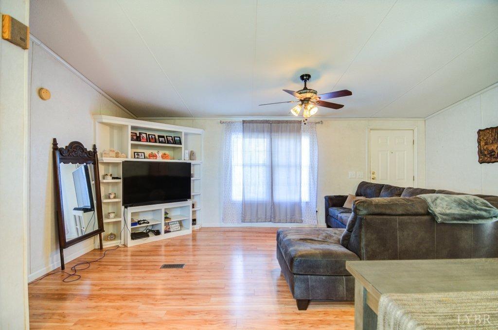 5029 Elon Road Monroe, VA 24574 - Photo 4 of 25 a living room with furniture and a flat screen tv