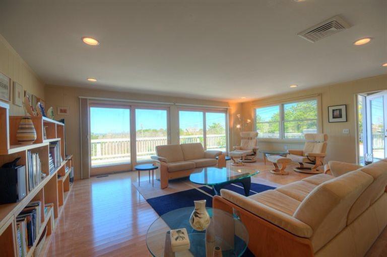 12 Cooper Road Truro, MA 02666 - Photo 2 of 32 a living room with furniture and a large window