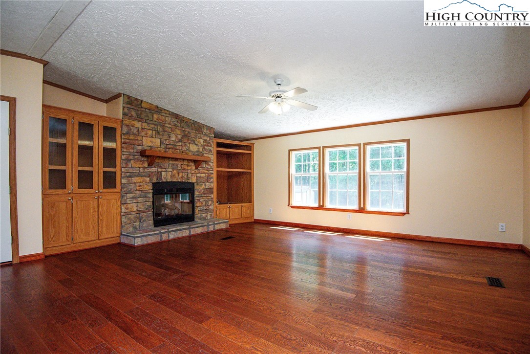 146 Fire House Road Whitetop, VA 24292 - Photo 12 of 44 a view of an empty room with wooden floor and a window
