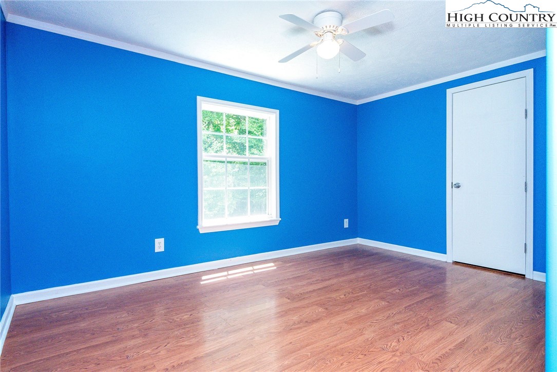 146 Fire House Road Whitetop, VA 24292 - Photo 25 of 44 a view of empty room with wooden floor and fan