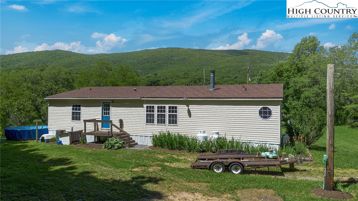 146 Fire House Road Whitetop, VA 24292 - Photo 3 of 44 a house view with a garden space