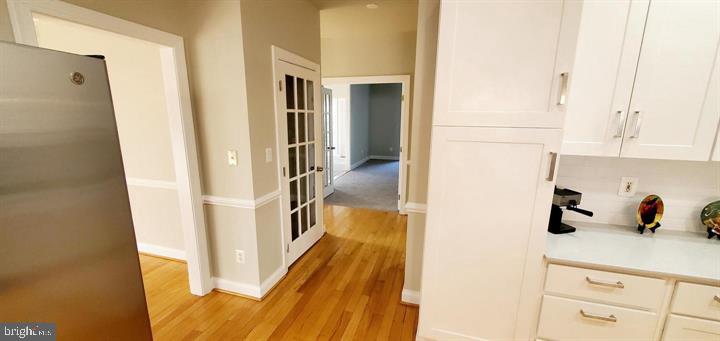 20153 Valhalla Square Ashburn, VA 20147 - Photo 13 of 26 a view of a kitchen from the hallway