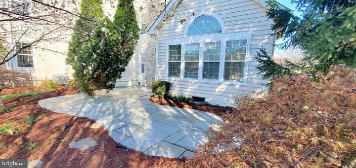 20153 Valhalla Square Ashburn, VA 20147 - Photo 18 of 26 a front view of a house with a yard