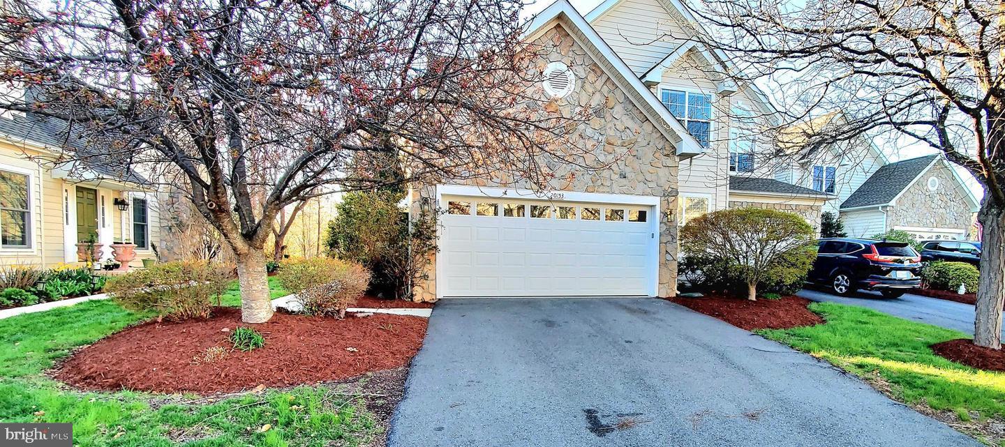 20153 Valhalla Square Ashburn, VA 20147 - Photo 24 of 26 a front view of a building with garden