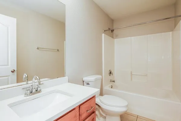 a view of a house with a wooden deck