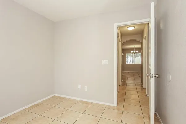 an empty room with mirror