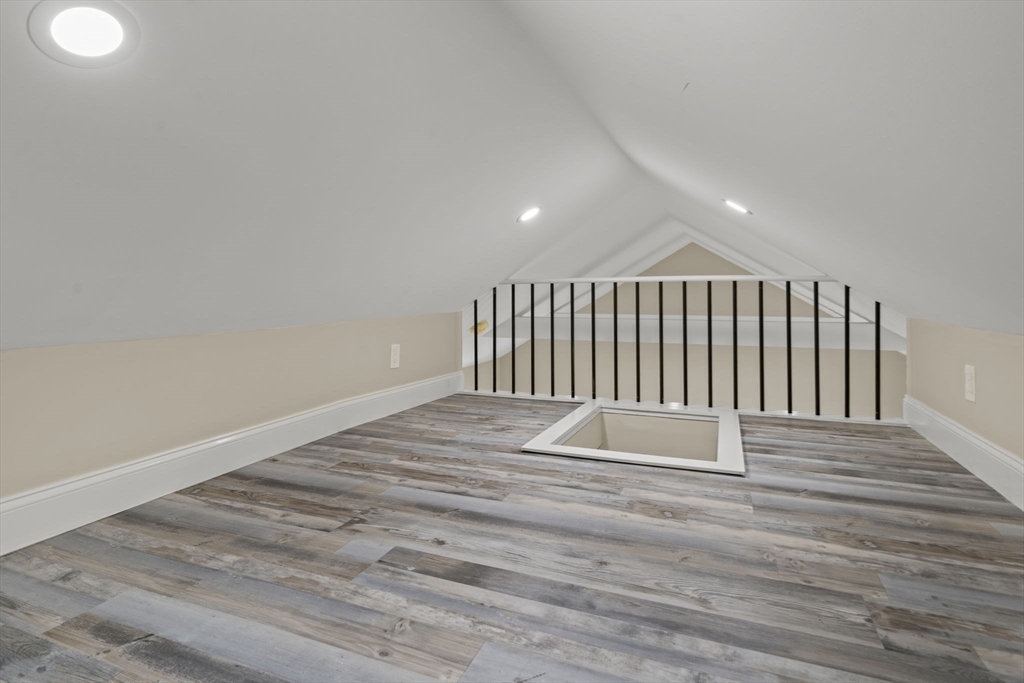 162 High Street, Unit B Danvers, MA 01923 - Photo 24 of 32 a view of wooden floor and windows in a room