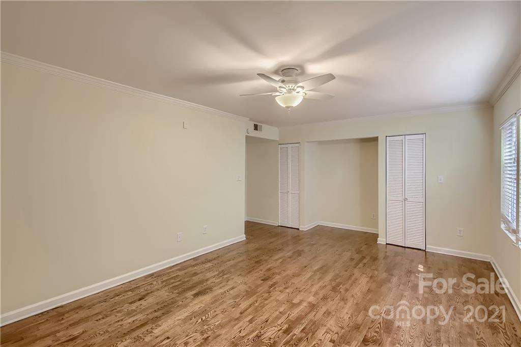 7040 Quail Hill Road Charlotte, NC 28210 - Photo 16 of 33 a view of empty room with wooden floor