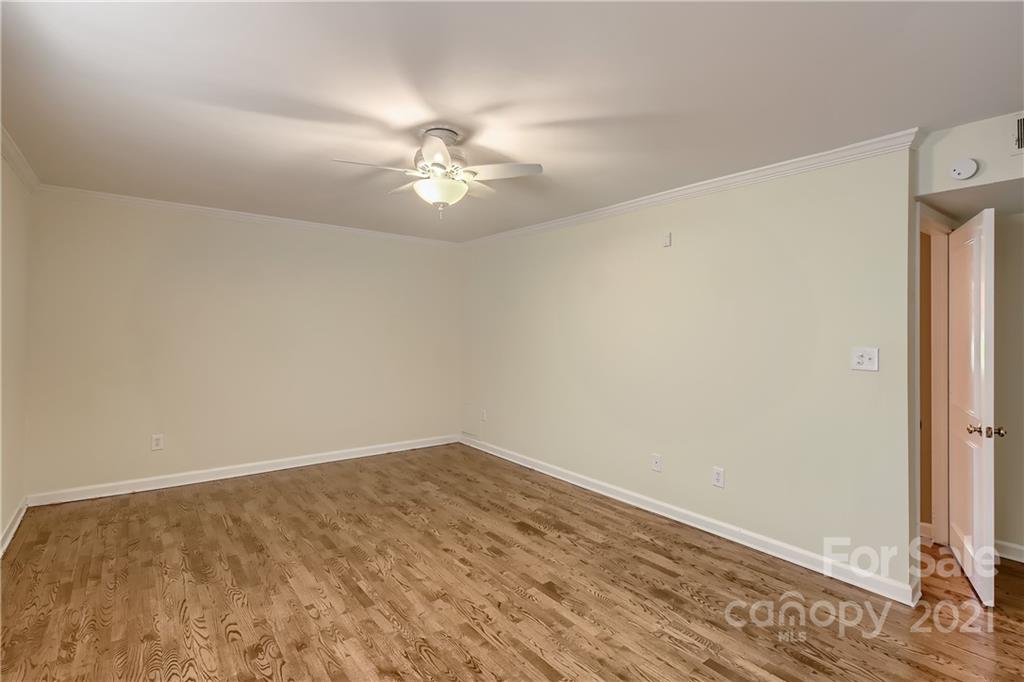 7040 Quail Hill Road Charlotte, NC 28210 - Photo 17 of 33 wooden floor in an empty room